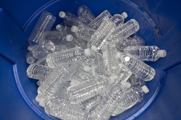 Bottles of water in a bucket, view from above